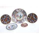 A pair of Chinese plates decorated birds and flowers on a black ground. 21 cm diameter together with