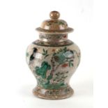 A Chinese famille vert crackle glaze baluster jar and cover decorated with birds and flowers,