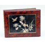 A Japanese Meiji period lacquer shibayama style photograph album containing thirty images of