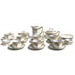 A Czechoslovakian Art Deco part tea service comprising eight cups and saucers, milk jug, sugar