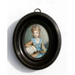 An 18th century portrait miniature on ivory depicting a woman with a blue ribbon in her hair, glazed