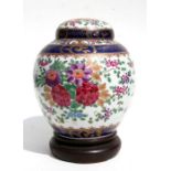 A Samson ginger jar and cover in the Chinese style decorated with flowers, 20cms high.