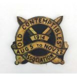 A rare WW1 Old Contemptibles Association advertising paper on plywood sign. 21.5cms (8.5ins) wide by