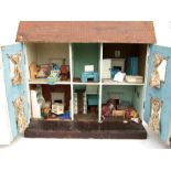 An early 20th century doll's house in the form of a Victorian villa with furniture and