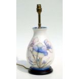A William Moorcroft table lamp decorated with irises, 28cms high.
