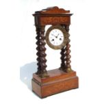 A mid 19th century French inlaid rosewood Portico mantle clock, the white enamel dial with Roman