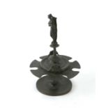 A bronze seal or pipe stand with central classical female figure, 21cms high.