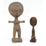 An Ashanti tribe carved wooden child's doll with bead necklace, 28cms high; together with a carved
