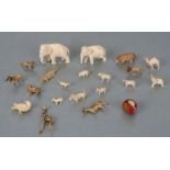 A group of early 20th century ivory and bone miniature animals to include a mouse seated on a cheese
