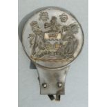 A vintage Hong Kong car badge with lion and dragon crest, 13cms high.