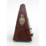 An early 20th century metronome by Maezel of London, in a walnut case, 22cms high.