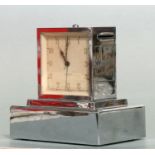 An Art Deco Winterthur Leben-Vie combination alarm clock / money box, in a chrome case, 12cms high.
