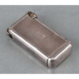 A Querceia Flaminaire Grillion white metal cased (possibly silver) French gas lighter, 7cms high.