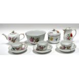 An 18th / 19th century KPM Berlin part tea service comprising teapot, lidded cream jug,. sugar bowl,