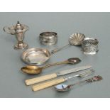 A quantity of silver items to include napkin rings, pin dish and cutlery.