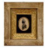 A Regency silhouette portrait depicting a lady mounted in a fancy gilt box frame, overall 25 by