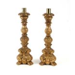 A pair of giltwood candlesticks, 37cms high.