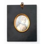 A Regency portrait miniature on ivory depicting a lady wearing a bonnet, inscribed to the back '