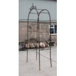 A wrought iron garden arch, 114cms wide.