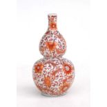 A Chinese double gourd vase with rough de fer decoration, red four character mark to base, 14cms