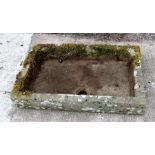 A well weathered carved stone shallow trough, 93 by 60cms; together with a carved stone stand, 67 by