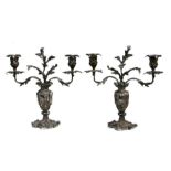 A pair of Victorian silver plated candelabra in the rococo style, 33cms high (2).