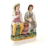 A Staffordshire flatback group 'Tam O' Shanter and Sooter Johnny', 33cms high.