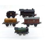 A quantity of Hornby 'O' gauge tin plate trains, carriages and track.