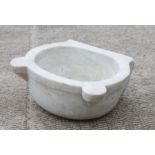 A white carved marble cistern or sink, 42cms wide.