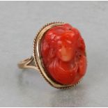 An antique 9ct gold coral cameo ring. Approx. UK size N