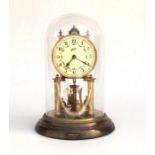 A Brass anniversary clock under a glass dome. 27cm high (a/f)