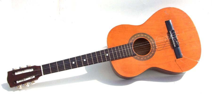 A six-string acoustic guitar, 92cms long.