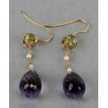 A pair of yellow metal peridot, amethyst and seed pearl drop earrings.