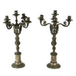 A pair of bronze five-branch candelabra with winged figural column, 59cms high.