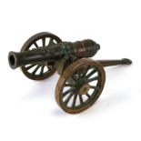 A large bronze model of a cannon, 37cms long, barrel length 24cms.