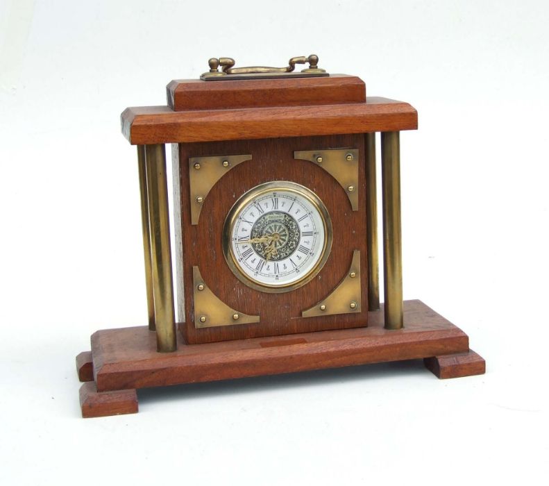 A mahogany and Brass West German mantle clock, the dial signed 'Mercedes', 25cms high.