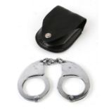 A pair of Hiatts (1960) Metropolitan Police handcuffs number 06865, in a leather case. (No Key).