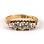 An 18 carat gold graduated five stone diamond ring, Sheffield 1893 UK size L, 3g