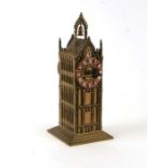 A brass Gothic tower mantle clock, 33cms high.