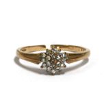 A 9ct gold diamond cluster ring, approx UK size 'N', 1.8g.