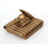 A trench art style model of a tank made from bullet casings, 13cms long.