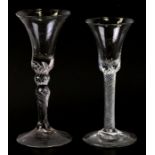 An 18th century wine glass with air twist stem, 16cms high; together with another similar with