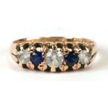 A 9ct gold sapphire and white stone dress ring, uk size L.