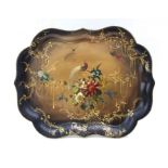 A 19th century papier mache lacquered shaped tray, decorated birds and flowers on a gilt and black