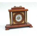 A mahogany and brass West German mantle clock, the dial signed 'Mercedes', 25cms high.