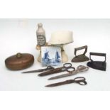 A collection of kitchenalia, including two Victorian irons, assorted iron and brass weights, scales,