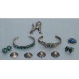A quantity of Navajo white metal jewellery set with turquoise to include bangles, earrings, a