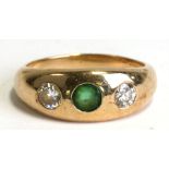 A 14ct gold gypsy ring set with two diamonds and an emerald. Approx. UK size L. 5.1gCondition