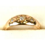 A Victorian 18ct gold three-stone diamond gypsy ring, Birmingham 1897, approx UK size 'Q', 4.1g.