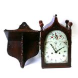 A 19th century bracket clock, the 20cm square arched painted dial with Arabic and Roman numerals,